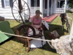 a woman spinning yarn