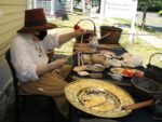 a woman making wampum