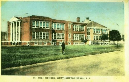 Historic view of Westhampton Beach High School, showcasing its brick architecture and landscaped lawn.